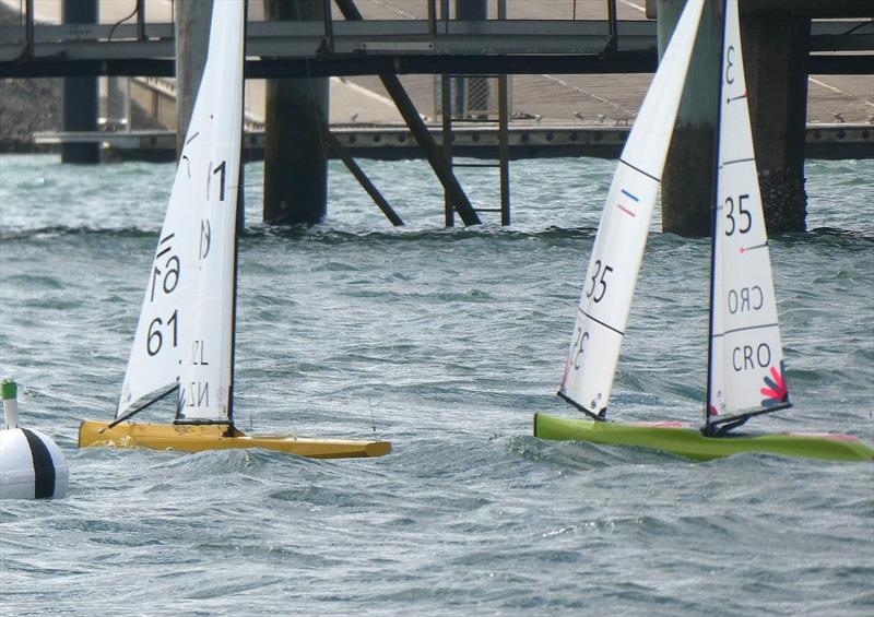 Ian and Zvonko battle on day 4 of the International One Metre World Championships in Gladstone, Australia photo copyright Nick Lindsley taken at  and featuring the One Metre class