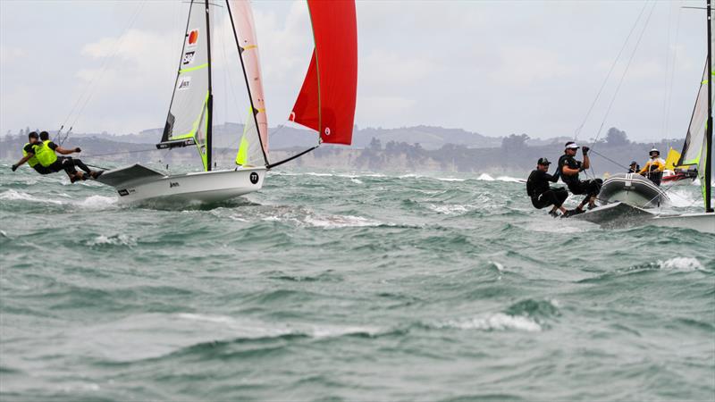 Two Kiwi crews with a different focus - Logan Dunning Beck and Oscar Gunn (7) focus on the finish of the Medal race, while behind them the backslaps and embraces begin for Peter Burling and Blair Tuke. Hyundai Worlds - December 2019 photo copyright Richard Gladwell / Sail-World.com taken at Royal Akarana Yacht Club and featuring the 49er class