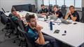 Emirates Team NZ's core sailing group meeting at the team base in Auckland