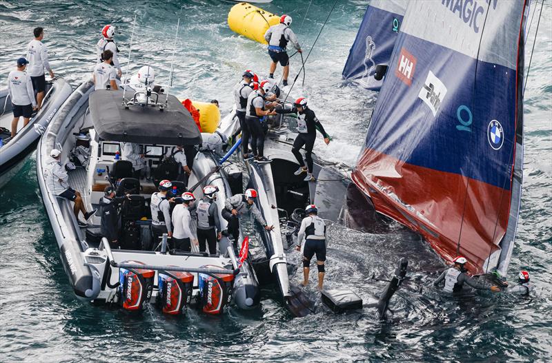 The America's Cup support teams work together to save NYYC American Magic's Patriot after a huge capsize on day 3 of the PRADA Cup photo copyright COR36 / Studio Borlenghi taken at  and featuring the AC75 class