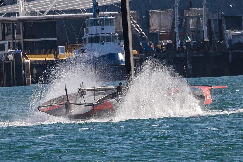 Emirates Team New Zealand tows home foils throw spray as the tow slows  - Waitemata Harbour - September 21 - photo © Richard Gladwell