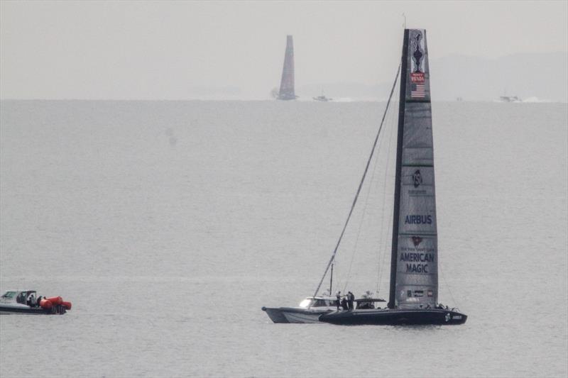 American Magic's Defiant with Emirates Team NZ's Te Aihe sailing in the background - August 10, 2020 - Hauraki Gulf - 36th America's Cup photo copyright Richard Gladwell / Sail-World.com taken at Royal New Zealand Yacht Squadron and featuring the AC75 class