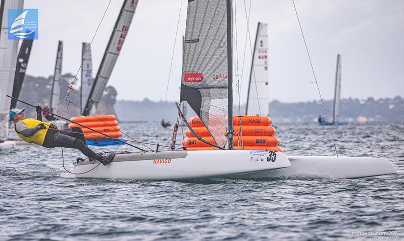 Jacek Noetzel POL, doing his characteristic Blowfish face - Day 5 Predictwind A-Class Catamaran World Championships - Milford, NZ - November 15, 2025 - photo © Gordon Upton / www.guppypix.com