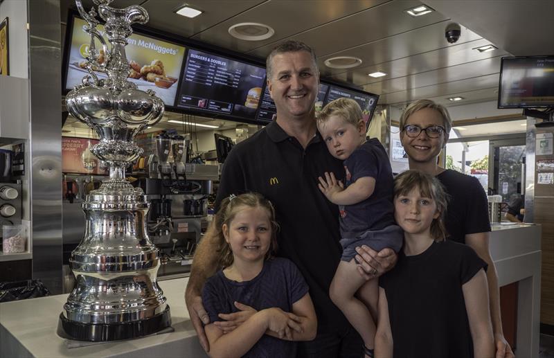 Local hero and team grinder Simon van Velthooven, along with the America's Cup trophy - McDonald's joins Emirates Team New Zealandas Official Family Partner  - February 2020 photo copyright Emirates Team New Zealand taken at Royal New Zealand Yacht Squadron and featuring the ACC class