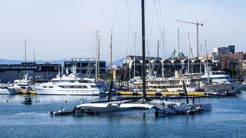 Alingi in the Darcena with superyachts. Emirates Team NZ's 2007 base in the left background - 33rd America's Cup - February 2010, Valencia, Spain photo copyright Richard Gladwell / Sail-World.com / nz taken at Lake Geneva Yacht Club and featuring the ACC class