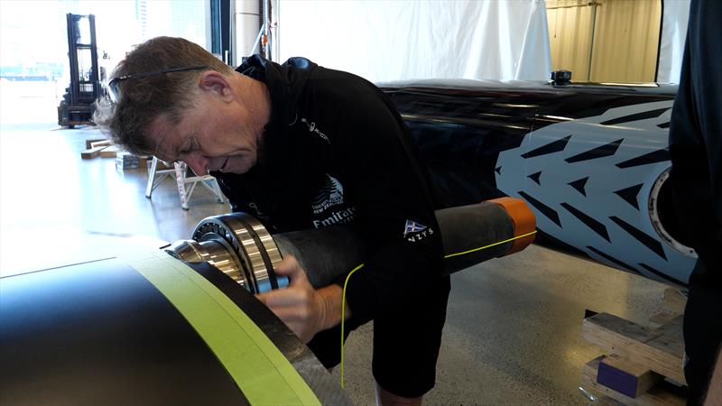 Sean Regan fits the wingsail bearings - Emirates Team New Zealand's land yacht is assembled ahead of the speed trial testing in Auckland - may 2022 - photo © Emirates Team New Zealand