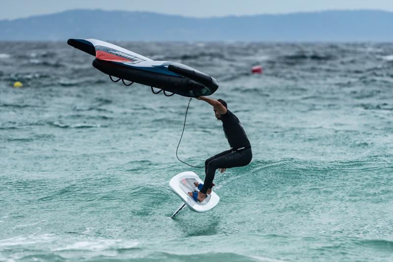 Blair Tuke turning down a wave during wing foiling session in Tarifa, Spain. - photo © Beau Outteridge