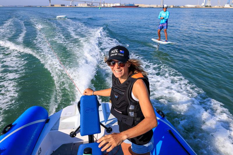 Jo Aleh, strategist of New Zealand SailGP Team, gives tips to the young sailors in the SailGP Inspire program trying out the Armstrong foil board ahead of the Spain Sail Grand Prix in Cadiz, Andalusia, Spain. 22nd September - photo © Felix Diemer/SailGP