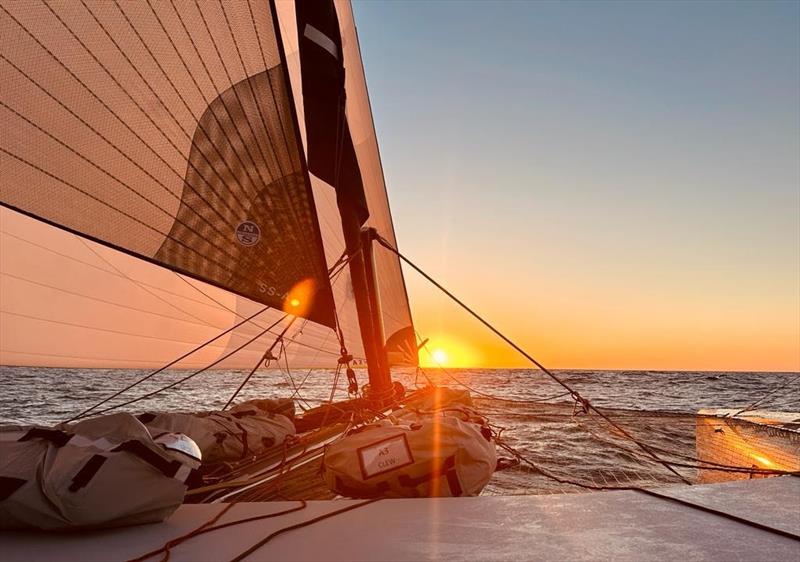 Sunset from on board Allegra - keeping a lookout for fishing boats and nets! photo copyright Helena Darvelid / Allegra taken at Royal Ocean Racing Club and featuring the Catamaran class