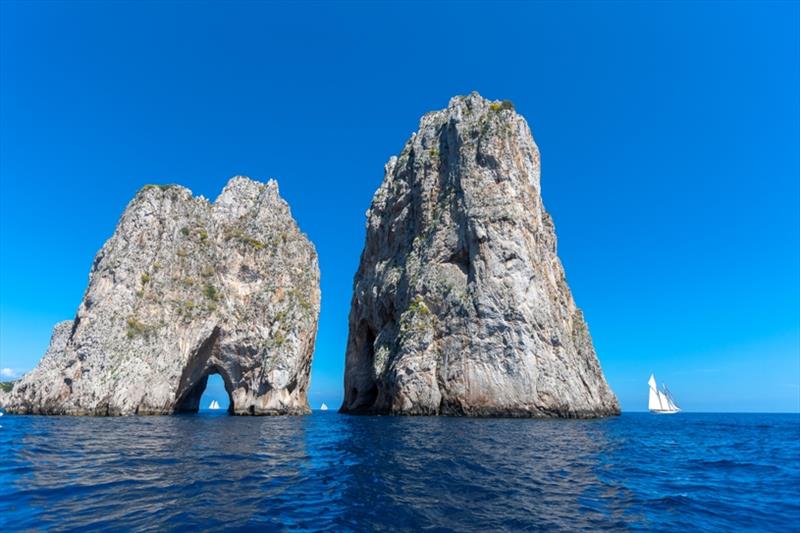 Schooners line up around the Faraglioni off Capri's southeast point - Capri Classica 2019 photo copyright Gianfranco Forza taken at Yacht Club Capri and featuring the Classic Yachts class