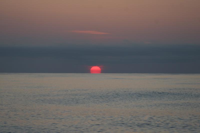 The sun setting over the Atlantic Ocean photo copyright Daria Blackwell taken at  and featuring the Cruising Yacht class