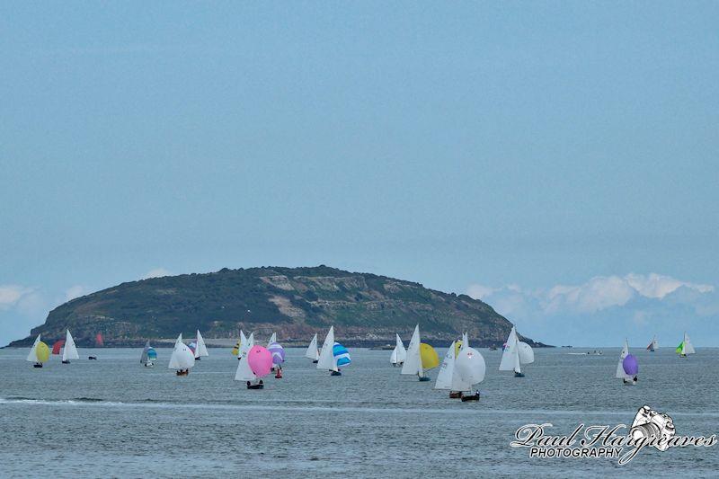 The fleet behind Zippy, returning from Puffin Island - Menai Strait Regattas photo copyright Paul Hargreaves Photography taken at Royal Welsh Yacht Club and featuring the Dinghy class