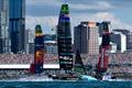 Spain SailGP Team helmed by Diego Botin, New Zealand SailGP Team helmed by Peter Burling and ROCKWOOL Denmark SailGP Team helmed by Nicolai Sehested sail past spectators in grandstand and Auckland city skyline on Race Day 1 of Rolex SailGP Championship