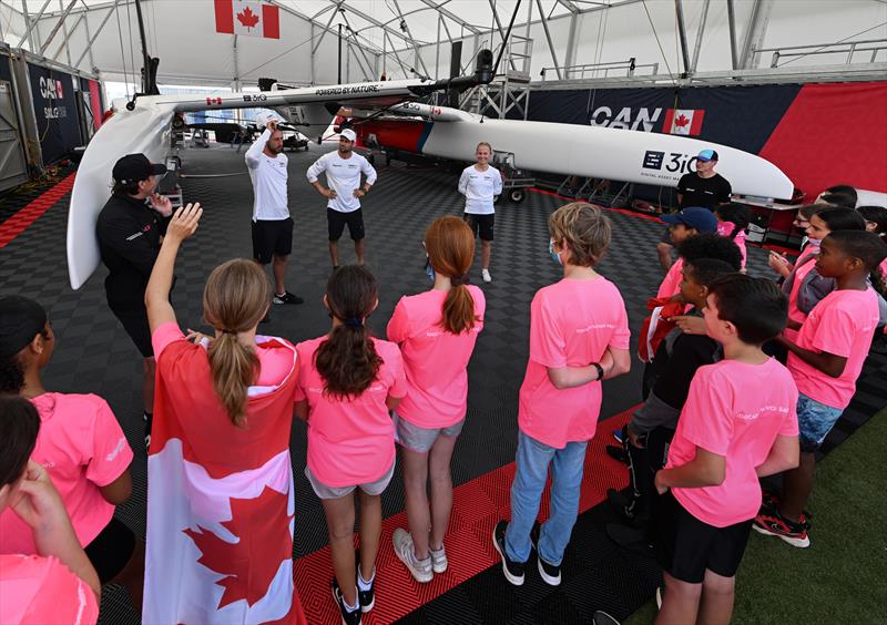 Guests of Endeavour, a Bermuda-registered charity that engages Bermuda's youth in experiential learning through sailing, speak with the Canada SailGP Team during a tour of the Technical Base ahead of Bermuda SailGP  Season 3 in Bermuda. May 2022 photo copyright Ricardo Pinto/SailGP taken at Royal Bermuda Yacht Club and featuring the F50 class