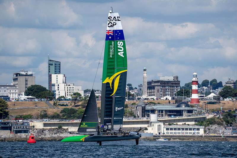 Australia SailGP Team helmed by Tom Slingsby sail past the waterfront and Smeaton's Tower during a practice session ahead of the Great Britain Sail Grand Prix | Plymouth in Plymouth, England photo copyright Bob Martin for SailGP taken at  and featuring the F50 class