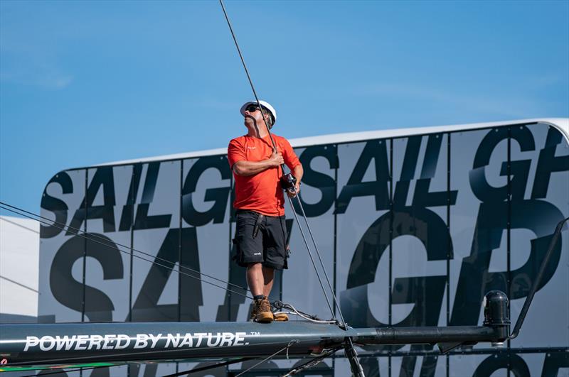 A crew member cleans the Australia SailGP Team F50 catamaran at the Technical Base after a practice session ahead of the Great Britain Sail Grand Prix | Plymouth in Plymouth, England. 29th July 2022 photo copyright Jon Super/SailGP taken at Royal Plymouth Corinthian Yacht Club and featuring the F50 class
