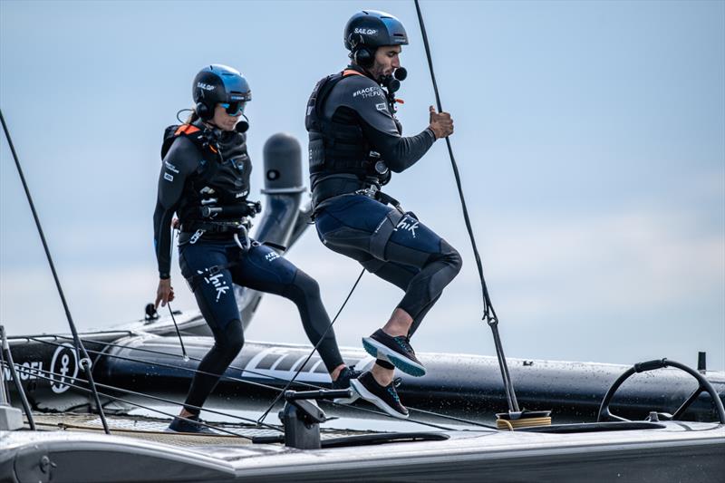 Blair Tuke, wing trimmer of New Zealand SailGP Team, and Jo Aleh of New Zealand SailGP Team run across the boat during a practice session ahead of the Great Britain Sail Grand Prix | Plymouth in Plymouth, England. 28th July 2022 photo copyright Ricardo Pinto/SailGP taken at Royal Plymouth Corinthian Yacht Club and featuring the F50 class