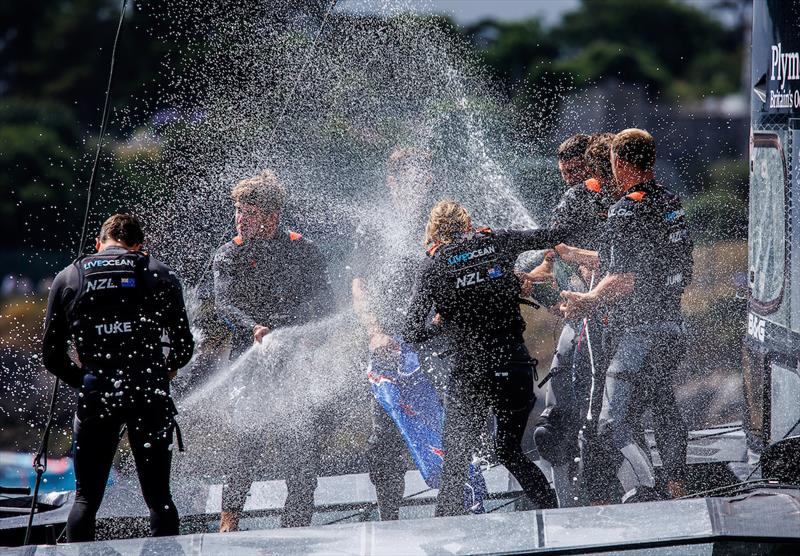 New Zealand SailGP Team spray Champagne Barons de Rothschild as they celebrate winning the Great Britain Sail Grand Prix | Plymouth in Plymouth, England. 31st July 2022 photo copyright David Gray/SailGP taken at Royal Plymouth Corinthian Yacht Club and featuring the F50 class