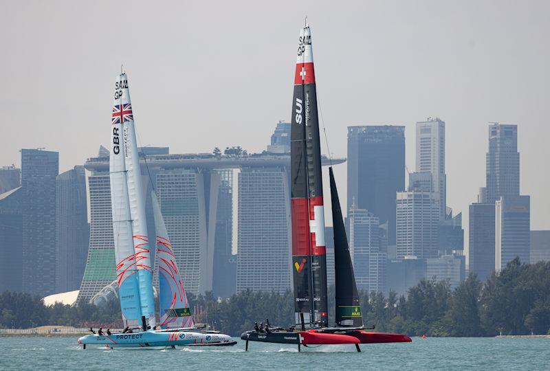 Great Britain SailGP Team and Switzerland SailGP Team sail past the Marina Bay Sands Hotel ahead of the Singapore Sail Grand Prix presented by the Singapore Tourism Board photo copyright Felix Diemer for SailGP taken at  and featuring the F50 class