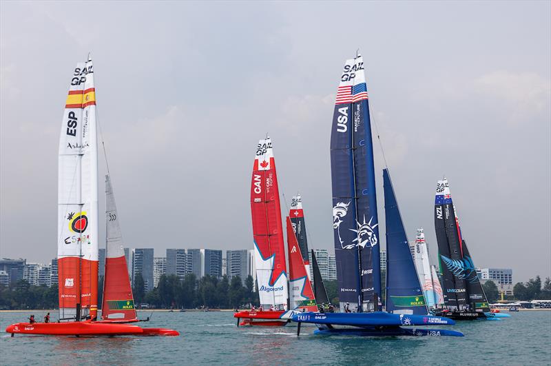 The F50 fleet start the delayed first race in light winds on Race Day 1 of the Singapore Sail Grand Prix presented by the Singapore Tourism Board photo copyright Felix Diemer for SailGP taken at  and featuring the F50 class