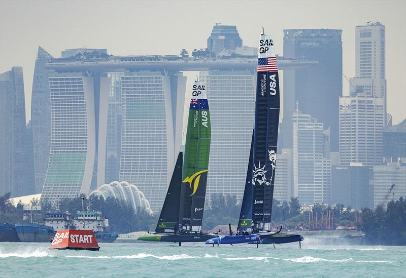 Australia SailGP Team helmed by Tom Slingsby and USA SailGP Team helmed by Jimmy Spithill in action during a practice session with the city skyline in the background ahead of the Singapore Sail Grand Prix  photo copyright Ian Walton for SailGP taken at Singapore Yacht Club and featuring the F50 class