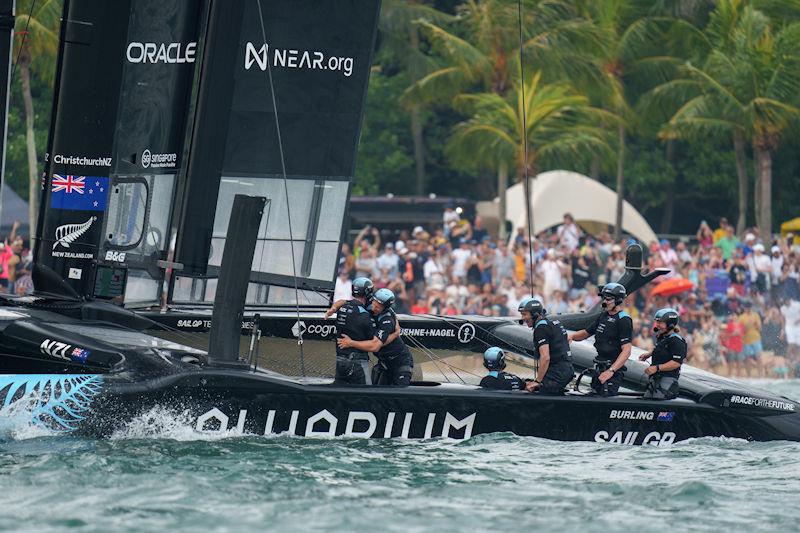 New Zealand SailGP crew celebrate as tgheuy cross the finish line to win the final race on Race Day 2 of the Singapore Sail Grand Prix presented by the Singapore Tourism Board photo copyright Bob Martin for SailGP taken at  and featuring the F50 class