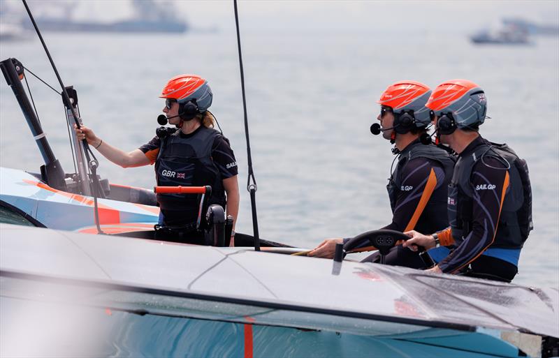 Hannah Mills, Ben Ainslie and Iain Jensen wait for the winds to pick up as the start of racing has ben postponed on Race Day 1 of the Singapore Sail Grand Prix presented by the Singapore Tourism Board photo copyright Ian Walton for SailGP taken at  and featuring the F50 class