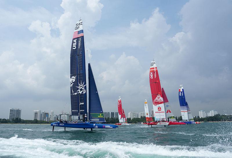 USA SailGP Team, Canada SailGP Team, Spain SailGP Team, Denmark SailGP Team presented by ROCKWOOL and France SailGP Team competing with the city skyline as a backdrop on Race Day 2 of the Singapore Sail Grand Prix presented by the Singapore Tourism Board photo copyright Bob Martin for SailGP taken at  and featuring the F50 class