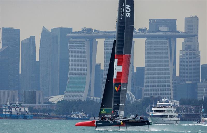 Switzerland SailGP Team helmed by Sebastien Schneiter racing with the Marina Bay Sands Hotel, the city and spectator boats as a backdrop on Race Day 2 of the Singapore Sail Grand Prix - photo © Felix Diemer for SailGP
