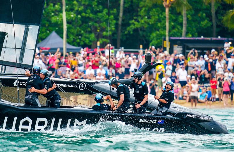 New Zealand SailGP crew celebrate as they cross the finish line to win the final race on Race Day 2 of the Singapore Sail Grand Prix  photo copyright Bob Martin/SailGP taken at Republic of Singapore Yacht Club and featuring the F50 class