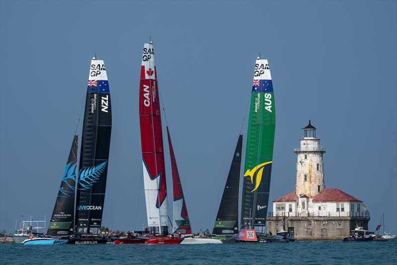 New Zealand SailGP Team, Canada SailGP Team and Australia SailGP Team sail past the Chicago Harbor Lighthouse during the final race on Race Day 2 of the Rolex United States Sail Grand Prix | Chicago photo copyright Bob Martin/SailGP taken at Lake Michigan Yacht Club and featuring the F50 class