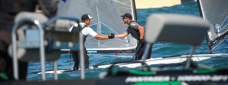 Josh Junior, right, congratulates Andy Maloney after winning this year's Finn Gold Cup photo copyright BB Duoro taken at Royal New Zealand Yacht Squadron and featuring the Finn class