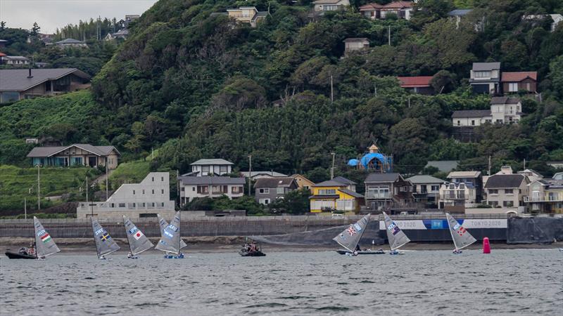 Tokyo2020 - Day 3 - July, 27, - Enoshima, Japan. Finns round their windwward mark placed close to shore, and with the breeze obstructed by the hill behind. Is this Olympic standard course placement? photo copyright Richard Gladwell - Sail-World.com / nz taken at Takapuna Boating Club and featuring the Finn class