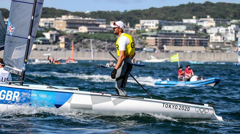 Giles Scott (GBR) acknowledges the moment of winning the Gold Medal in the Finn class, Tokyo2020 - Day 10 - August 3, , Enoshima, Japan photo copyright Richard Gladwell - Sail-World.com/nz taken at  and featuring the Finn class