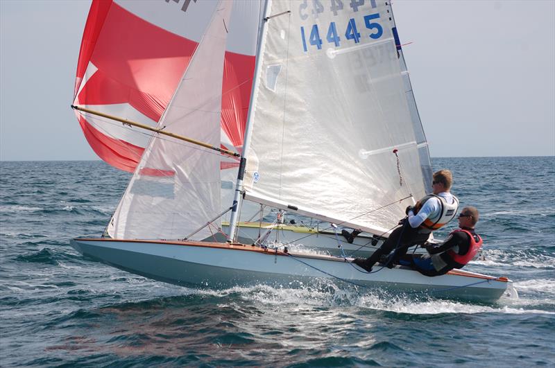 Milne's brilliance was to create a scow hull form that enjoyed a reasonably modest surface wetted area for a boat with a flat panel that ran from bow to stern - photo © D Henshall