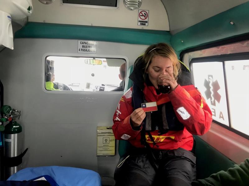 Susie Goodall enjoying a hot drink in the ambulance that carried her to hospital for a checkup after her arrival in Punta Arenas on 16th Dec photo copyright Javier Contreras / PPL / GGR taken at  and featuring the Golden Globe Race class