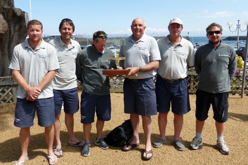 Half Ton Classics Cup Champions Peter Morton (third from right) and his crew of Swuzzlebubble with the trophy photo copyright Fiona Brown / www.fionabrown.com taken at Sport Nautique de Saint-Quay-Portrieux and featuring the Half Tonner class