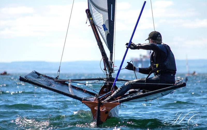 George finely balanced during the International Moth Lowriders Scottish Nationals at Largo Bay photo copyright Max Campbell taken at Largo Bay Sailing Club and featuring the International Moth class