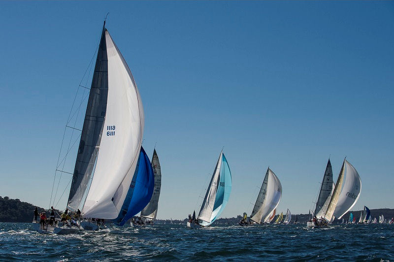 Competitors enjoy a lovely spinnaker ride down the Harbour during the CYCA Winter Series photo copyright www.sailpix.com.au taken at Cruising Yacht Club of Australia and featuring the IRC class