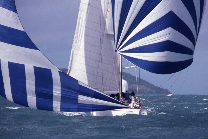 Maxi Ragamuffin – originally Bumblebee IV – sails downwind under spinnaker and blooper at the inaugural Hamilton Island Race Week in 1984. The yacht will celebrate its 40th birthday at Race Week this year photo copyright Sandy Peacock taken at Hamilton Island Yacht Club and featuring the IRC class