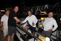 Scarlet Oyster's Ross Applebey welcomes Richard Palmer and Jeremy Waitt after finishing the RORC Transatlantic Race