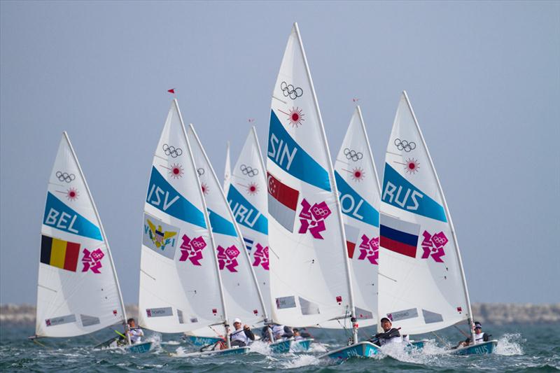 Men's Laser fleet on day three of the London 2012 Olympic Sailing Competition photo copyright Tom Gruitt / www.tom-gruitt.co.uk taken at Weymouth & Portland Sailing Academy and featuring the ILCA 7 class