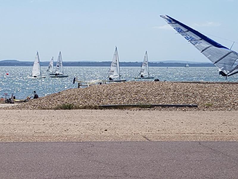 Lasers on the shore at Stokes Bay photo copyright Grace Clark taken at Stokes Bay Sailing Club and featuring the ILCA 7 class