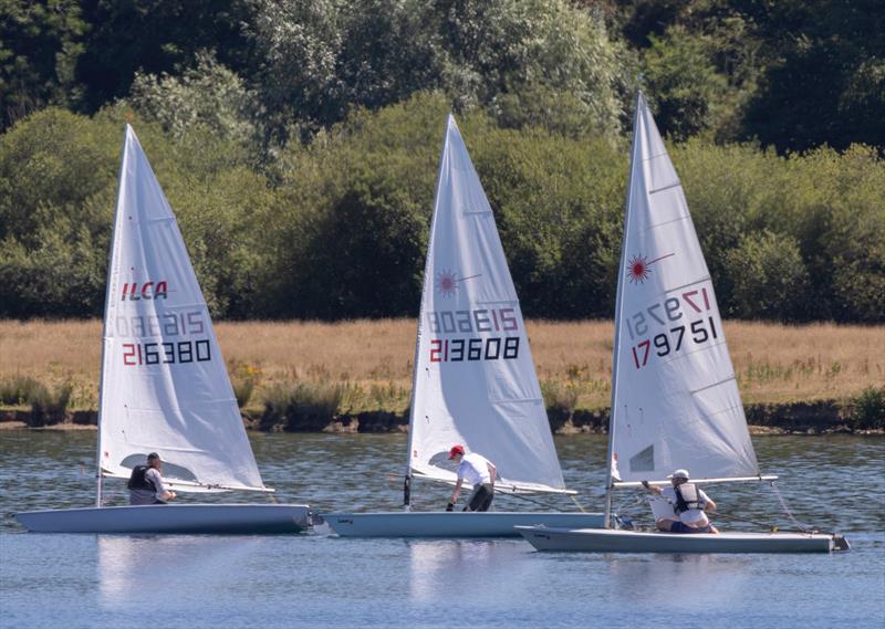 Goerge Fereday (middle), winner in the close racing on the first race during the Notts County ILCA Open photo copyright David Eberlin taken at Notts County Sailing Club and featuring the ILCA 7 class