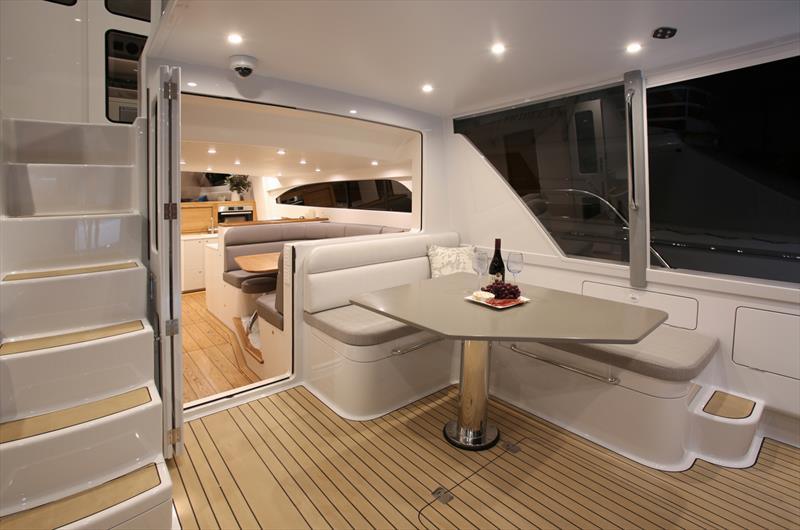 Cockpit, exterior mid-pilothouse stairs, exterior dinette. Note: the window between the dinettes is electrically actuated with the bi-fold cockpit doors sealing directly against the glass when in the cl - Zaphira - 18m Elite - Lloyd Stevenson Boatbuilders - photo © Bryce Taylor.