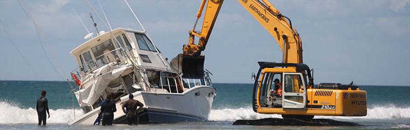 The vessel couldn't be winched free of the water and was eventually broken up and removed by diggers. - photo © Bay of Plenty Times