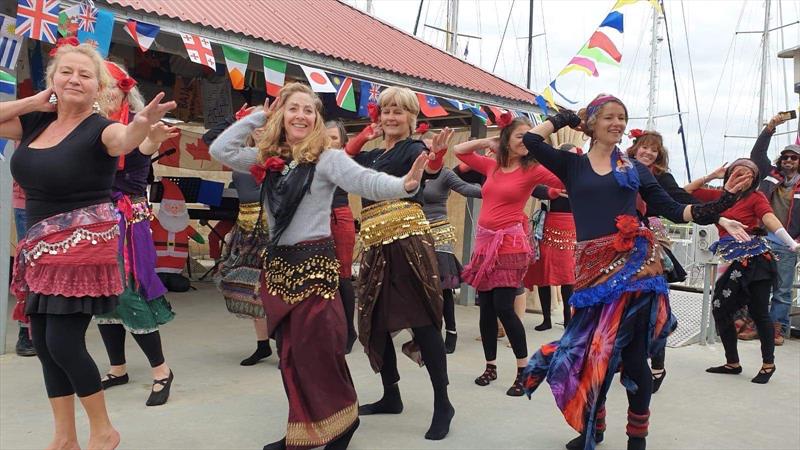 The belly dance troupe -  I wish we could say we were serving a higher purpose on this occasion, but maybe it's enough just to be having a bit of fun in our floating community photo copyright Lisa Benckhuysen taken at 