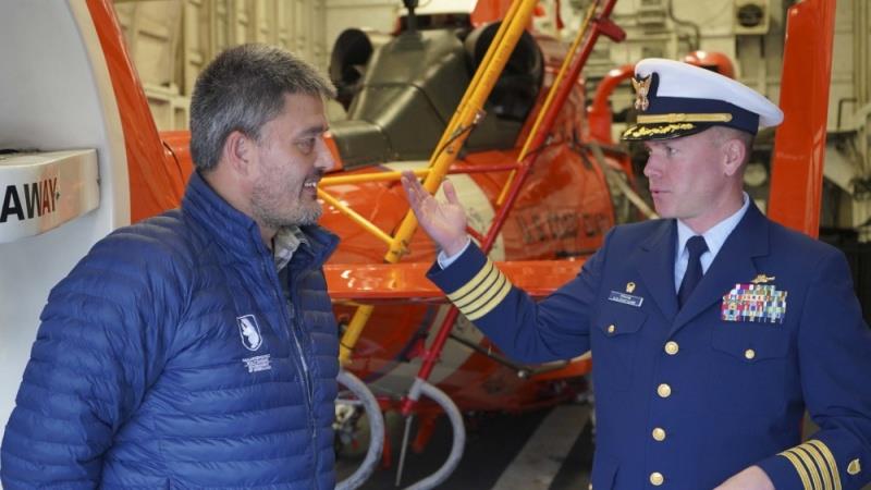 Capt. Thomas Crane, commanding officer USCGC Campbell (WMEC 909), discusses the cutter's capabilities with Greenland's Premier, Mr. Kim Kielsen, aboard the ship in Nuuk, Greenland, Sept. 15, 2020. - photo © Seaman Kate Kilroy / U.S. Coast Guard