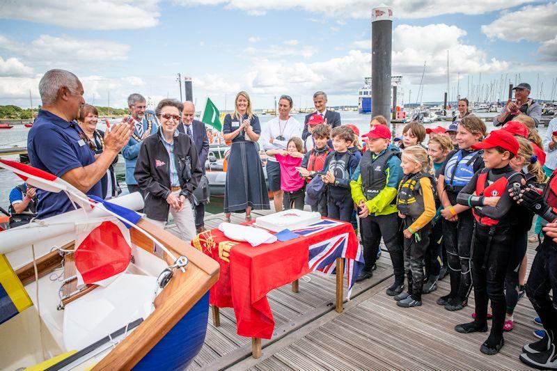 A smiling Princess Anne cuts a centenary cake on the pontoon - Youth Regatta Week at Royal Lymington photo copyright Alex & David Irwin / www.sportography.tv taken at Royal Lymington Yacht Club