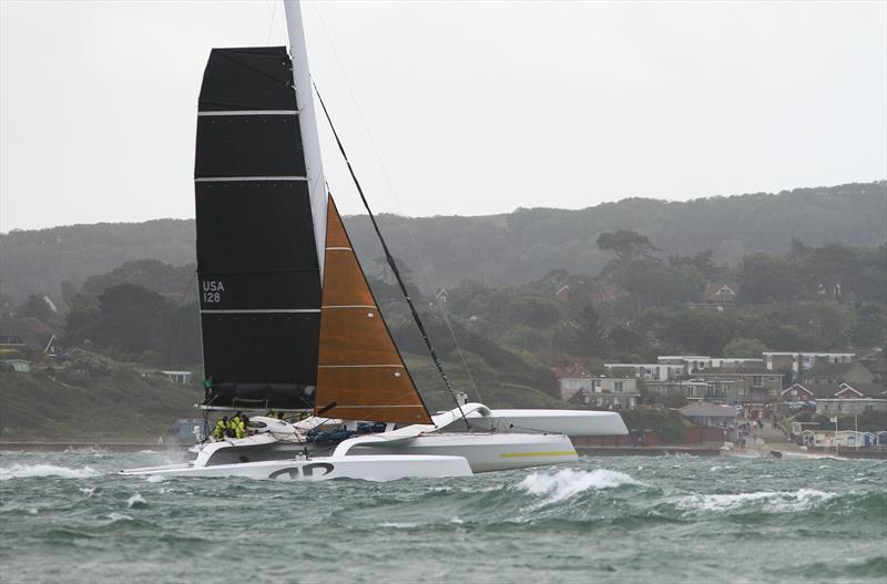 Argo passes Hurst Castle after the Rolex Fastnet Race start photo copyright Mark Jardine taken at Royal Ocean Racing Club and featuring the MOD70 class